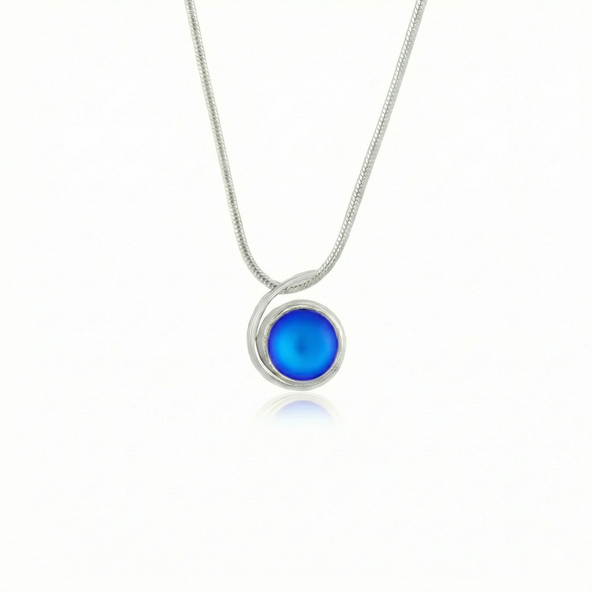 Small Wave Pendant, where it represents the "O" of Ocean Beach, while the surrounding silver symbolizes the "B." The pendant comes with a 1mm sterling silver snake chain, 18" long, with a frosted blue stone.