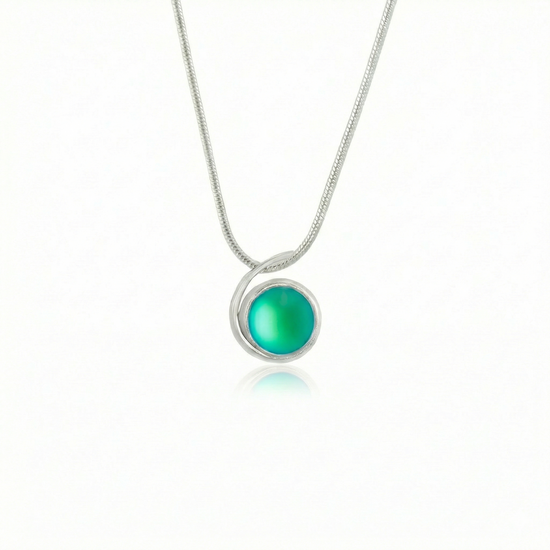 Small Wave Pendant, where it represents the "O" of Ocean Beach, while the surrounding silver symbolizes the "B." The pendant comes with a 1mm sterling silver snake chain, 18" long, with a frosted green stone.