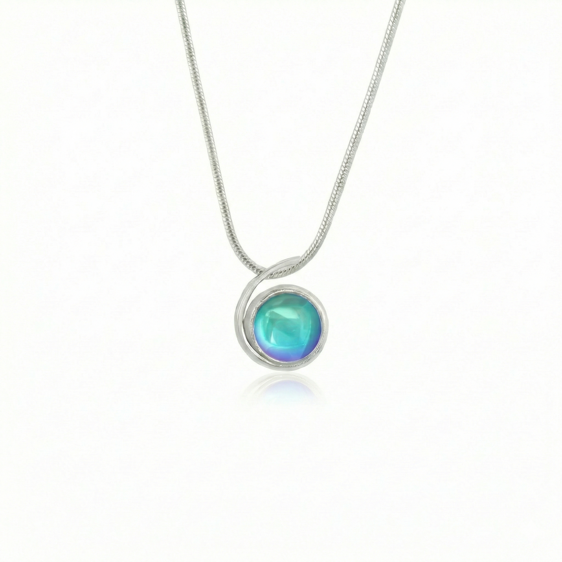 Small Wave Pendant, where it represents the "O" of Ocean Beach, while the surrounding silver symbolizes the "B." The pendant comes with a 1mm sterling silver snake chain, 18" long, with a polished aqua stone.