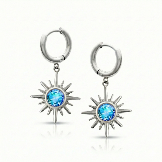 Silver hoop earrings with star-shaped blue gemstones.