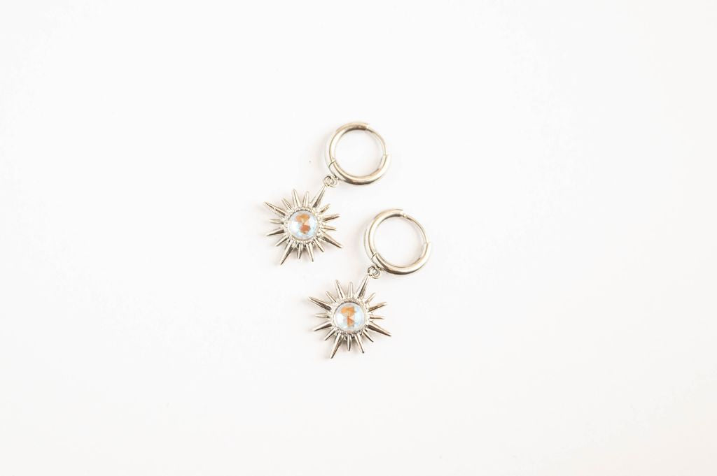 Star Earrings Celestial-inspired star earrings that capture the timeless allure of the night sky. These pieces feature carefully crafted star designs that evoke wonder and cosmic elegance.