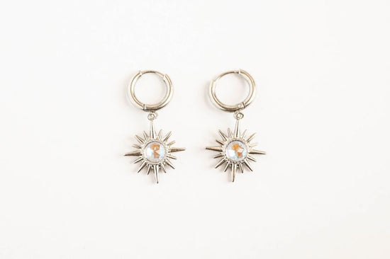 Star Earrings Celestial-inspired star earrings that capture the timeless allure of the night sky. These pieces feature carefully crafted star designs that evoke wonder and cosmic elegance.