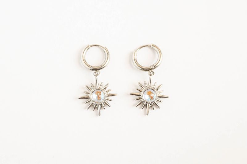Star Earrings Celestial-inspired star earrings that capture the timeless allure of the night sky. These pieces feature carefully crafted star designs that evoke wonder and cosmic elegance.
