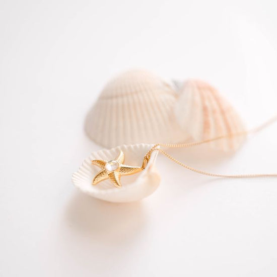 Starfish Necklace, Pendants. Bring a little ocean breeze to your everyday look with this playful starfish pendant—effortlessly beachy, subtly chic, and made to layer or wear solo for an instant dose of seaside charm; a perfect, carefree gift for anyone who loves sun, sand, and style.