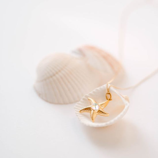 Starfish Necklace, Pendants. Bring a little ocean breeze to your everyday look with this playful starfish pendant—effortlessly beachy, subtly chic, and made to layer or wear solo for an instant dose of seaside charm; a perfect, carefree gift for anyone who loves sun, sand, and style.