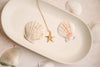  Starfish Necklace, Pendants. Bring a little ocean breeze to your everyday look with this playful starfish pendant—effortlessly beachy, subtly chic, and made to layer or wear solo for an instant dose of seaside charm; a perfect, carefree gift for anyone who loves sun, sand, and style.