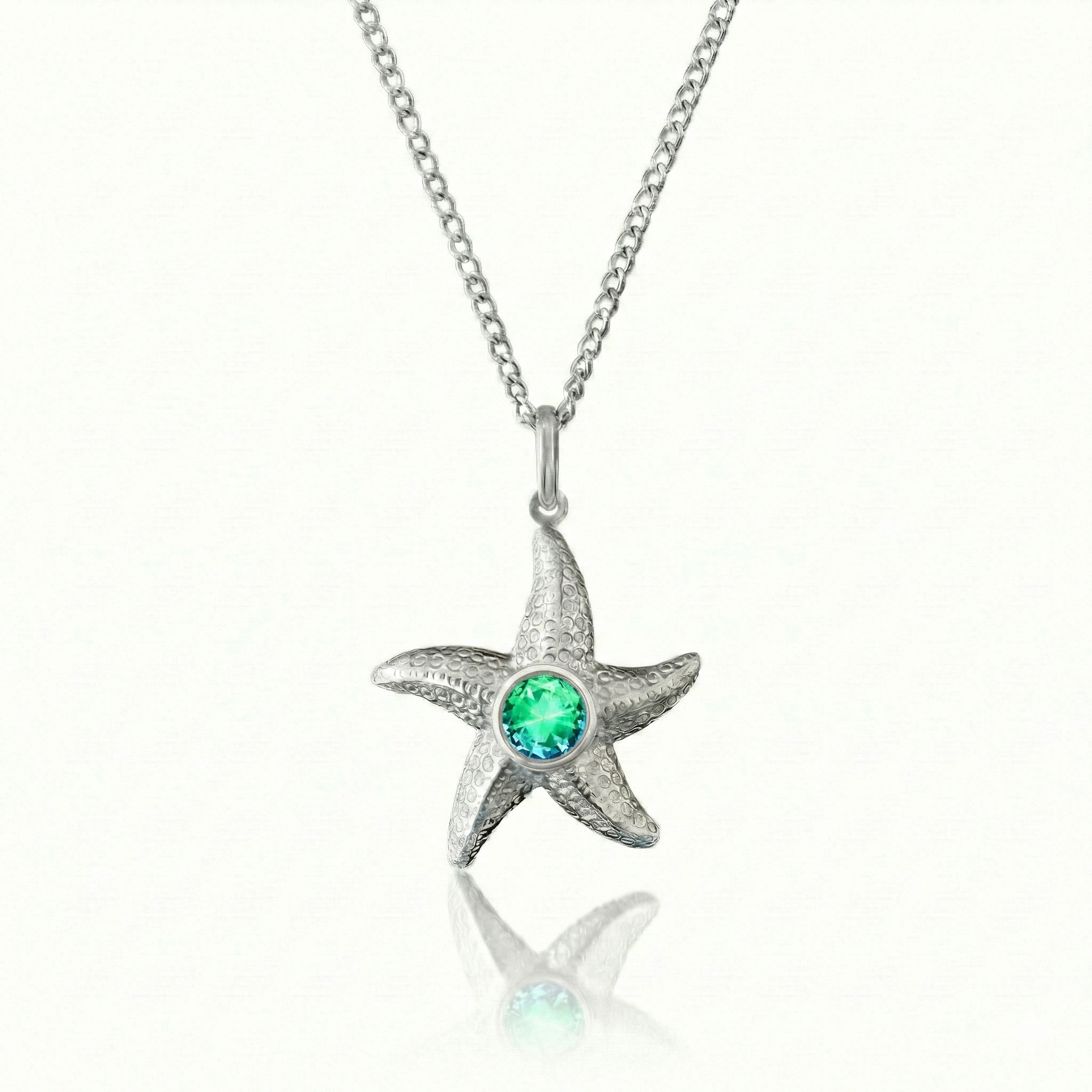Starfish Necklace featuring a 16"-18" adjustable silver stainless chain with  5mm round green stone.