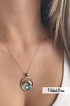 Swell Pendant are crafted in 18" sterling silver .7mm box chain wave pendant with round frosted blue crystal.