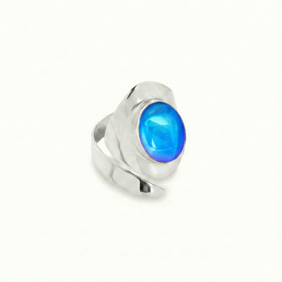 Sting Ray Inspired Ring features bold lines that create a captivating visual effect with a polished blue stone