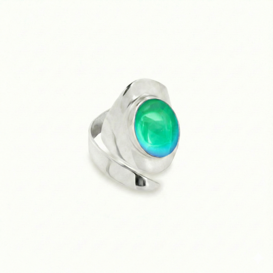 Sting Ray Inspired Ring features bold lines that create a captivating visual effect with a polished green stone
