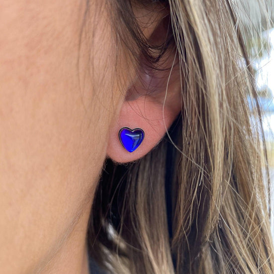 Stud Heart Earrings featuring a stunning 7mm polished violet stone set in .925 sterling silver posts.