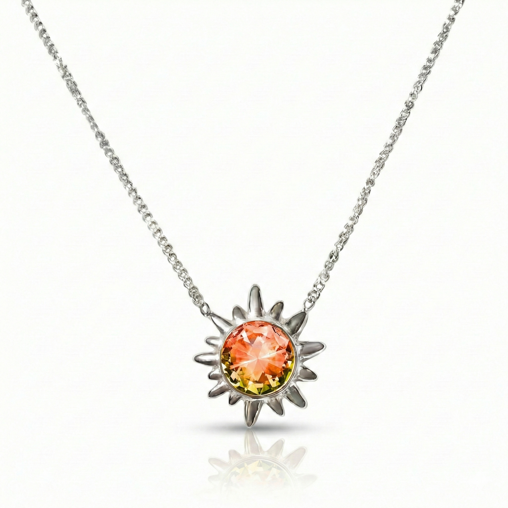 Sunburst Crystal Necklace features a 16"-18" silver stainless adjustable chain with 5mm fire stone.