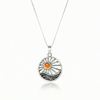 This handcrafted design captures the essence of twilight, featuring a glowing crystal set in solid sterling silver to reflect the warm, calming tones of a setting sun. 