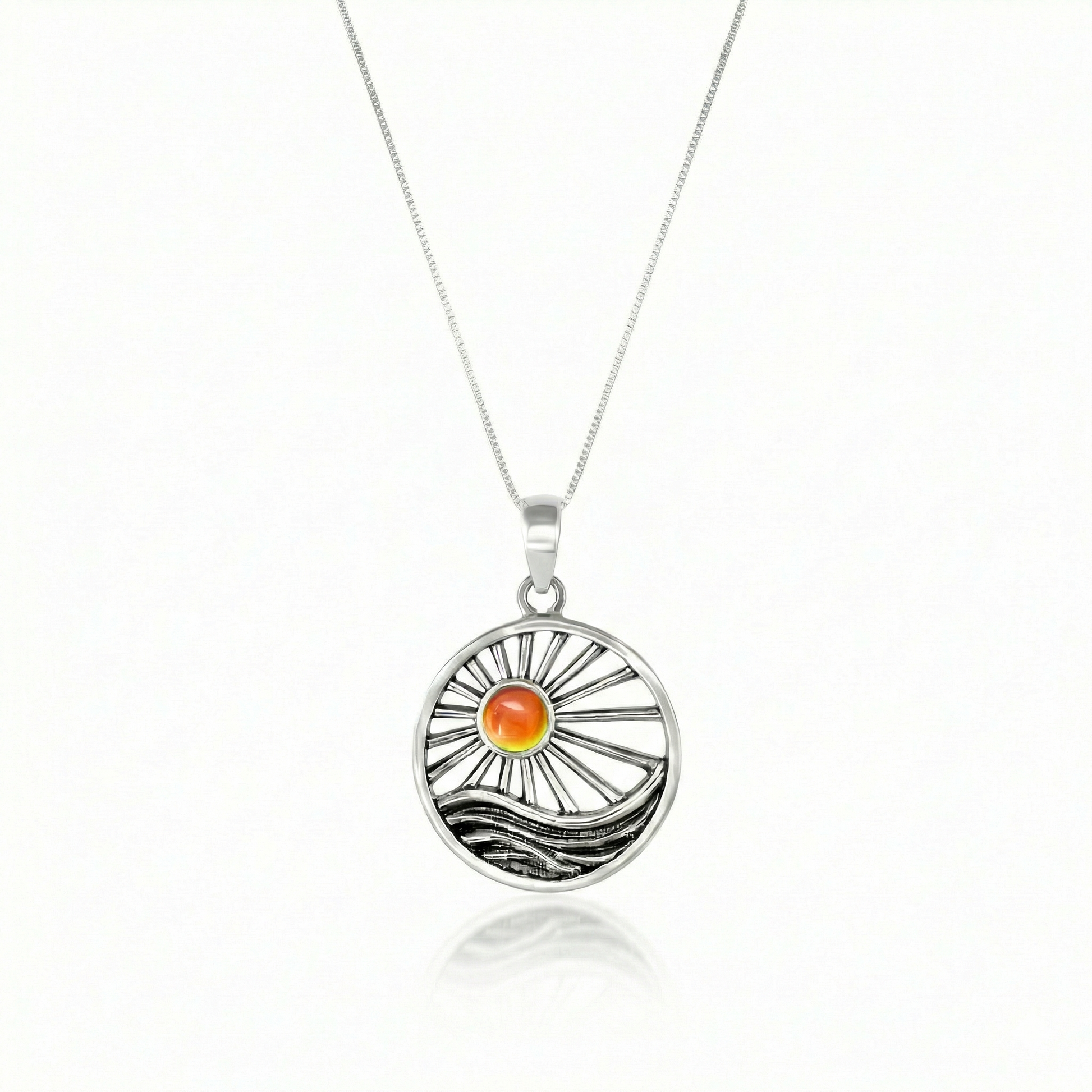 This handcrafted design captures the essence of twilight, featuring a glowing crystal set in solid sterling silver to reflect the warm, calming tones of a setting sun. 