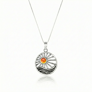 This handcrafted design captures the essence of twilight, featuring a glowing crystal set in solid sterling silver to reflect the warm, calming tones of a setting sun. 