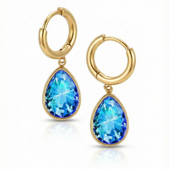 Teardrop Crystal Earrings are meticulously crafted to catch the light and add a dash of elegance with 9 mm blue stone and 11mm diameter 18K gold stainless hoop.