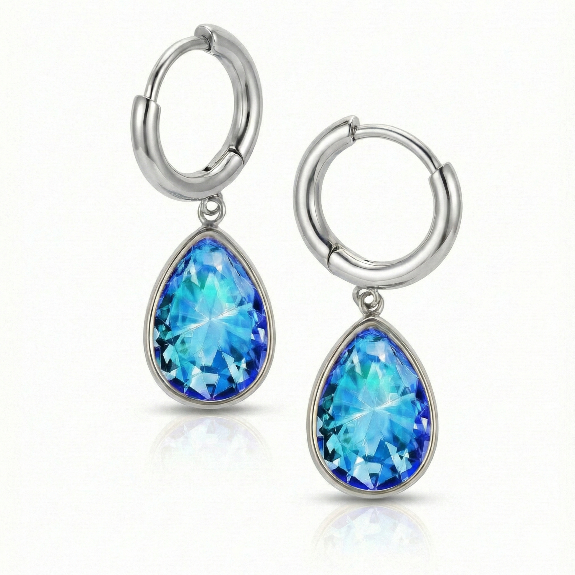 Teardrop Crystal Earrings are meticulously crafted to catch the light and add a dash of elegance with 9 mm blue stone and 11mm diameter silver stainless hoop.