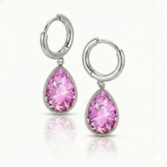 Teardrop Crystal Earrings are meticulously crafted to catch the light and add a dash of elegance with 9 mm pink stone and 11mm diameter silver stainless hoop.