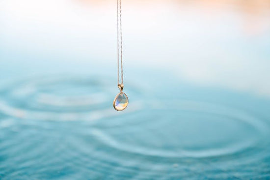 Teardrop Crystal Pendant, a beautifully designed piece that exudes sophistication and grace. This elegant pendant, shaped like a delicate teardrop, is perfect for adding a touch of sparkle to your everyday ensemble or an enchanting shimmer to your evening wear