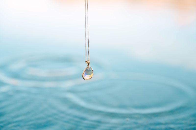 Teardrop Crystal Pendant, a beautifully designed piece that exudes sophistication and grace. This elegant pendant, shaped like a delicate teardrop, is perfect for adding a touch of sparkle to your everyday ensemble or an enchanting shimmer to your evening wear