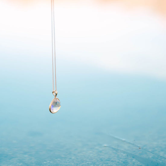 Teardrop Crystal Pendant, a beautifully designed piece that exudes sophistication and grace. This elegant pendant, shaped like a delicate teardrop, is perfect for adding a touch of sparkle to your everyday ensemble or an enchanting shimmer to your evening wear