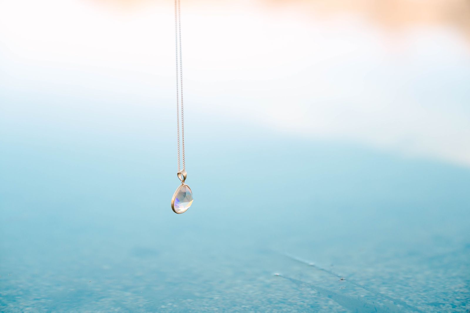 Teardrop Crystal Pendant, a beautifully designed piece that exudes sophistication and grace. This elegant pendant, shaped like a delicate teardrop, is perfect for adding a touch of sparkle to your everyday ensemble or an enchanting shimmer to your evening wear