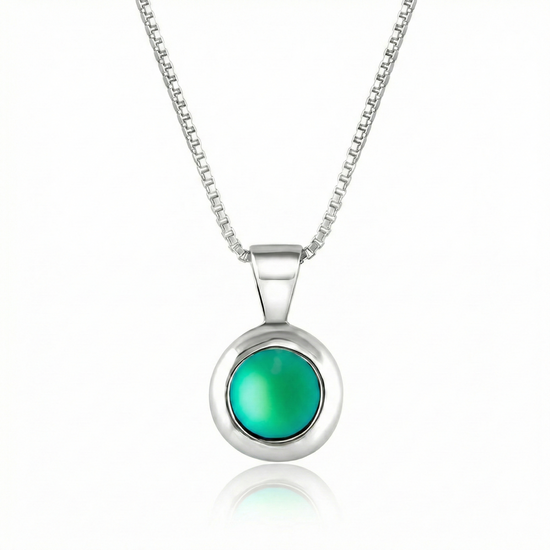 Teeny Tiny Pendant crafted with a thick silver bezel and featuring a stunning 5mm glowing frosted green stone. The pendant comes complete with an 18" sterling silver box chain.