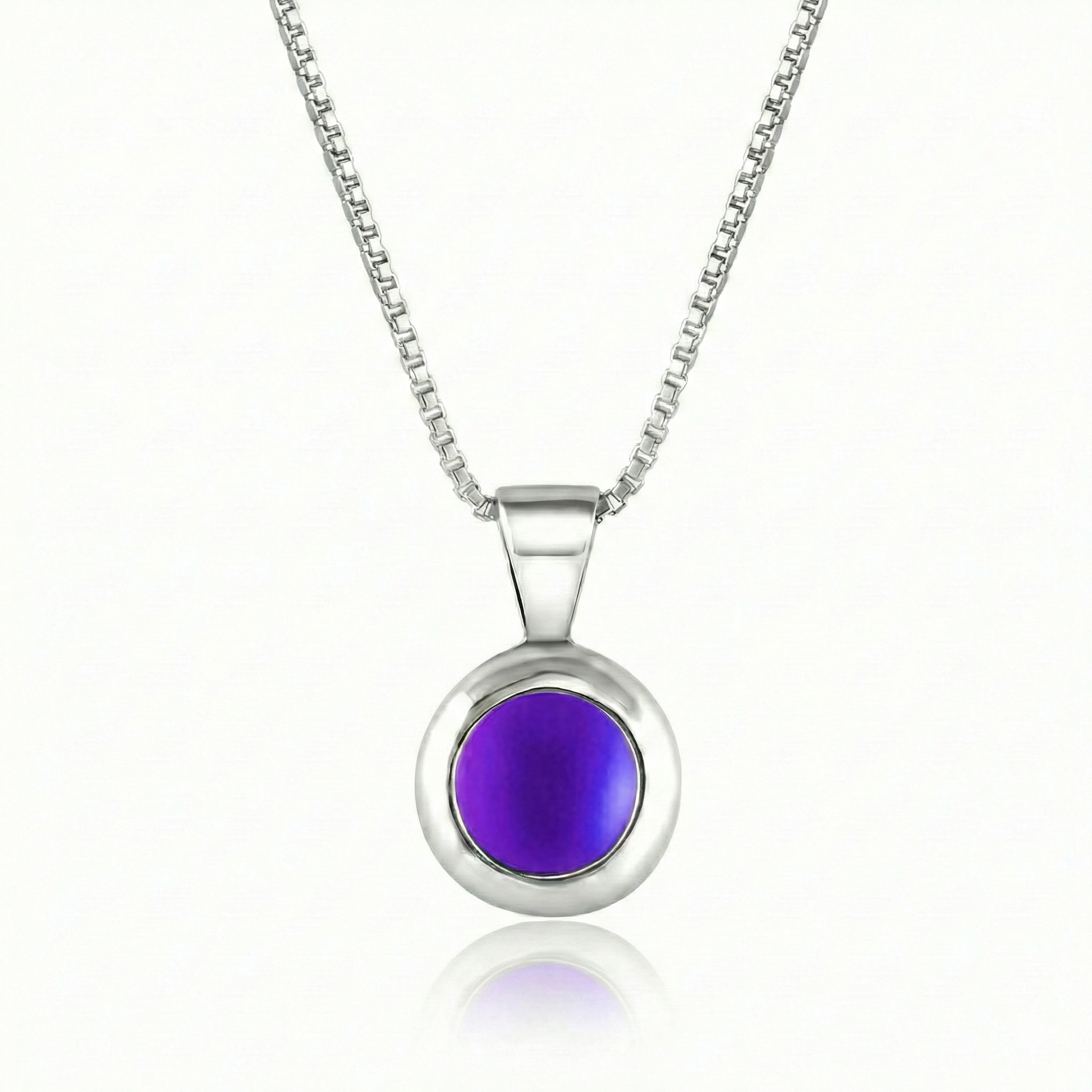 Teeny Tiny Pendant crafted with a thick silver bezel and featuring a stunning 5mm glowing frosted violetstone. The pendant comes complete with an 18" sterling silver box chain.
