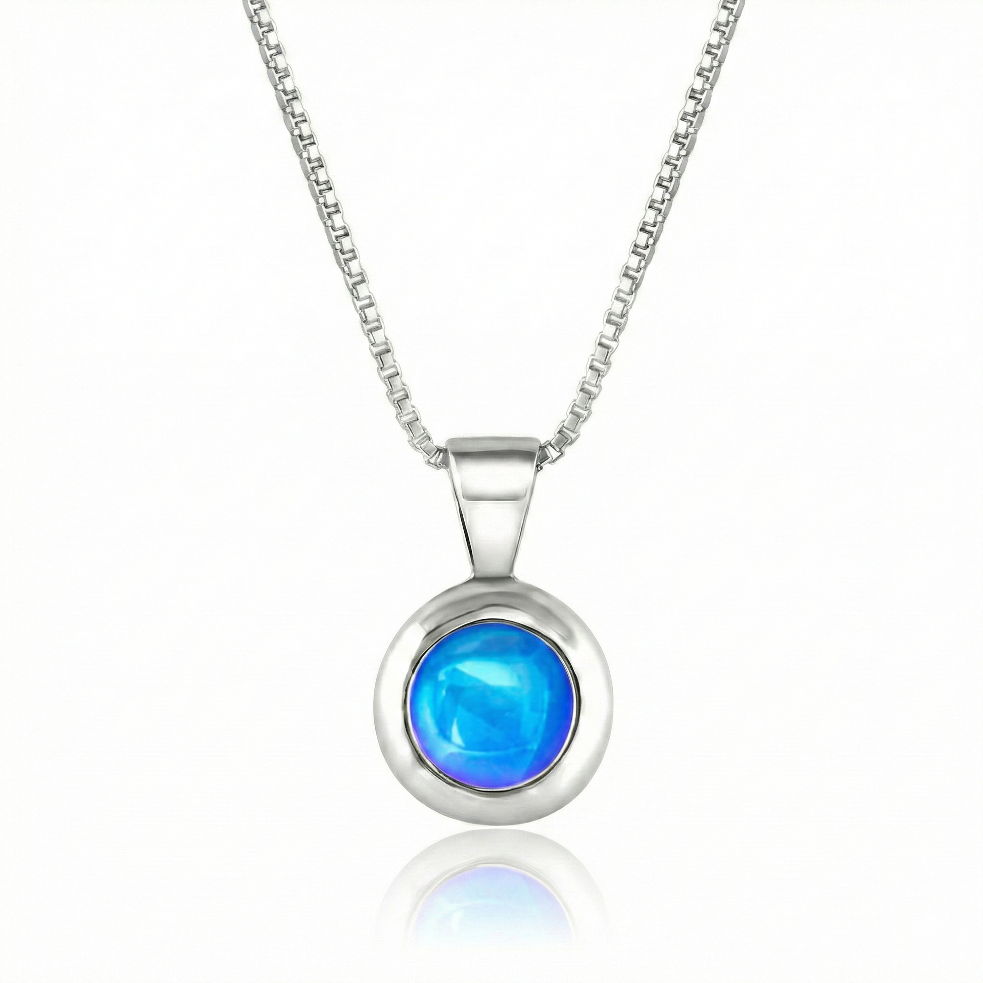 Teeny Tiny Pendant crafted with a thick silver bezel and featuring a stunning 5mm glowing polished blue stone. The pendant comes complete with an 18" sterling silver box chain.