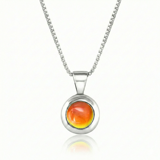 Teeny Tiny Pendant crafted with a thick silver bezel and featuring a stunning 5mm glowing polished fire stone. The pendant comes complete with an 18" sterling silver box chain.