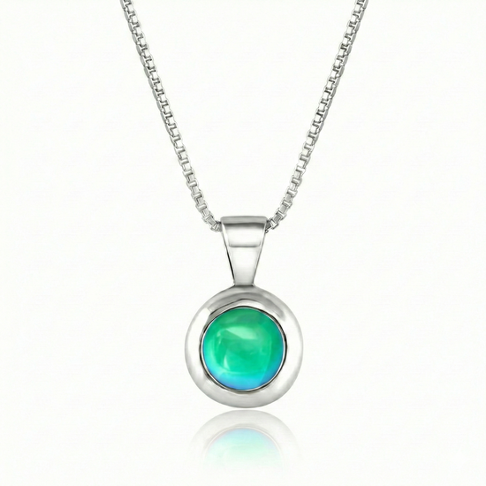 Teeny Tiny Pendant crafted with a thick silver bezel and featuring a stunning 5mm glowing polished green stone. The pendant comes complete with an 18" sterling silver box chain.