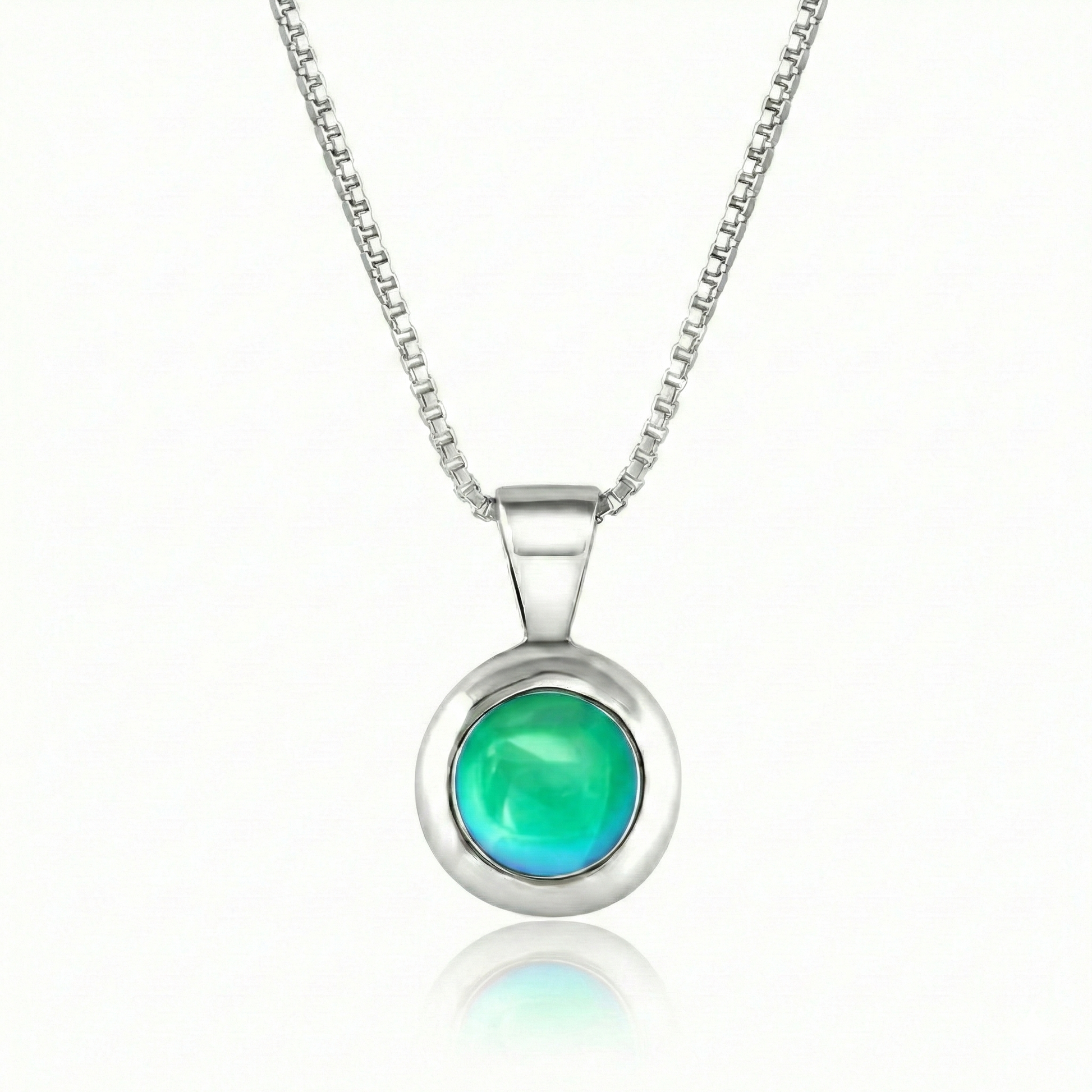 Teeny Tiny Pendant crafted with a thick silver bezel and featuring a stunning 5mm glowing polished green stone. The pendant comes complete with an 18" sterling silver box chain.