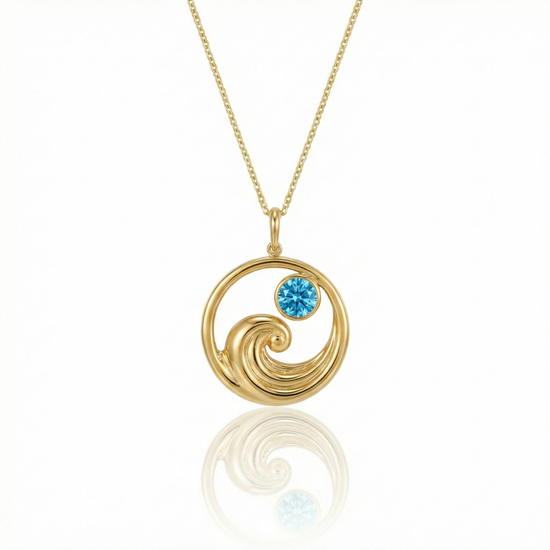 Gold featuring a minimalist ocean wave charm with a blue gemstone on a delicate chain