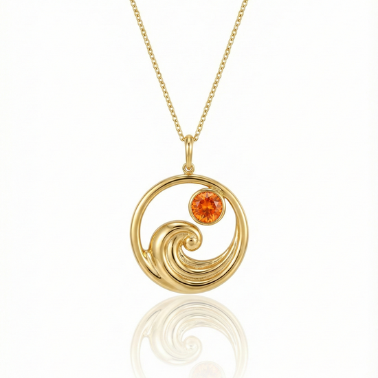 Gold featuring a minimalist ocean wave charm with a fire gemstone on a delicate chain