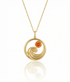 Gold featuring a minimalist ocean wave charm with a fire gemstone on a delicate chain