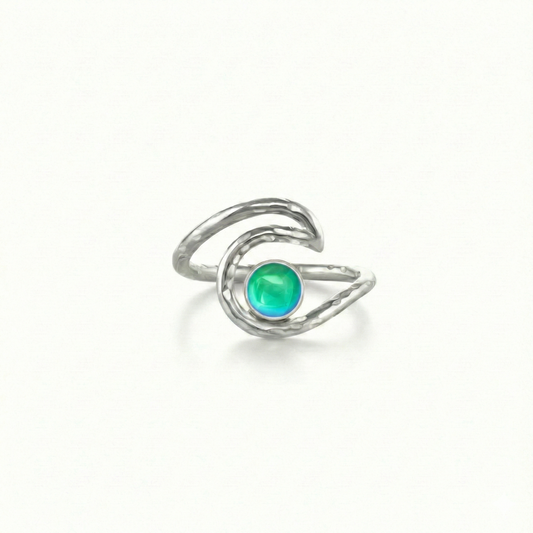 Wave Ring, this waterproof and durable design is crafted from solid sterling silver, ensuring it will last a lifetime. Featuring a stunning 5mm polished green stone, this ring captures the essence of the ocean's beauty and adds a touch of charm to any outfit.