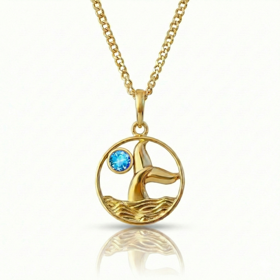 Whale tale pendant with 18K gold stainless steel and a blue gemstone.