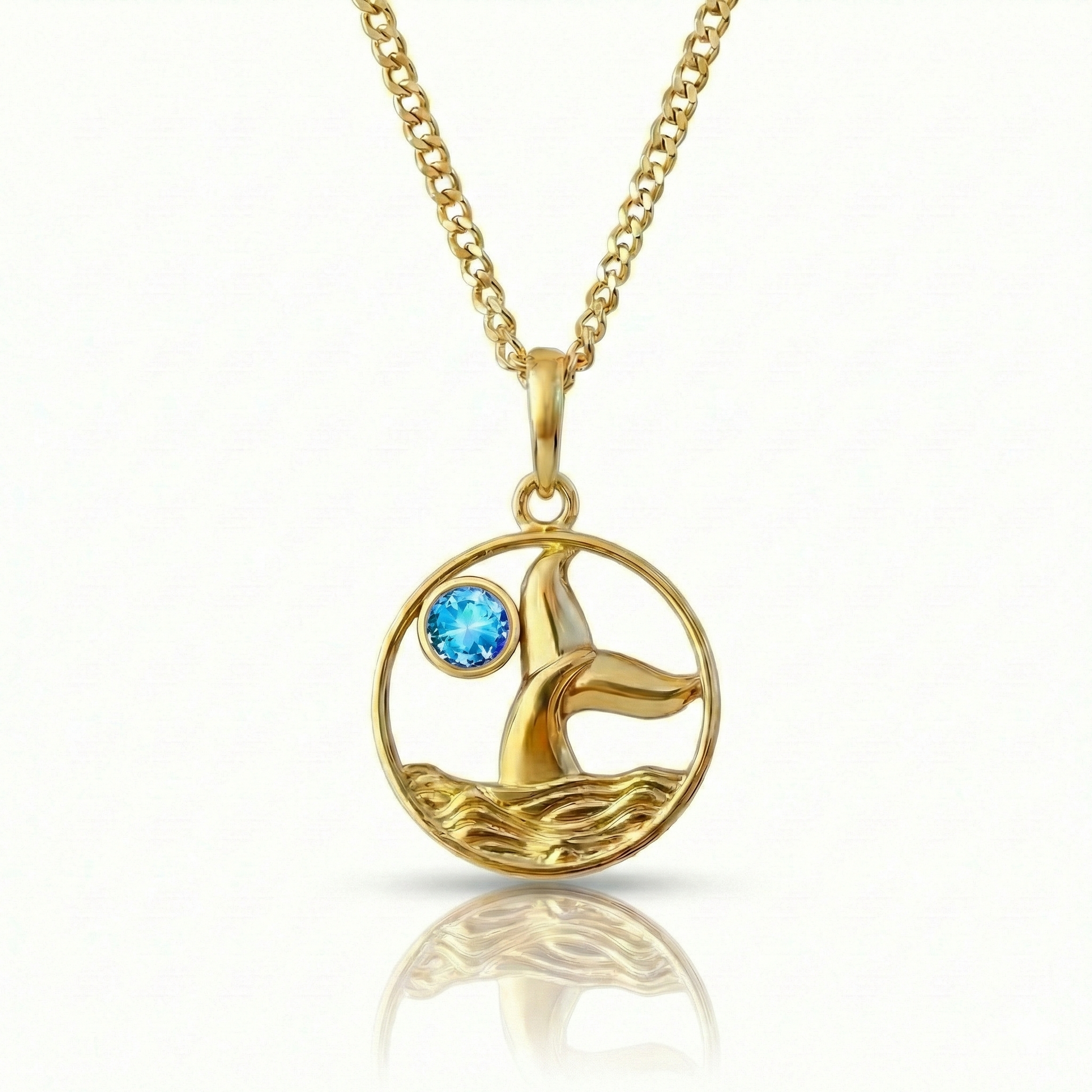 Whale tale pendant with 18K gold stainless steel and a blue gemstone.