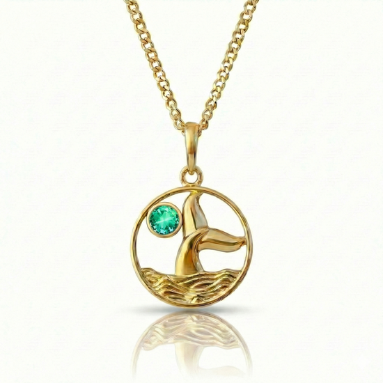 Whale tale pendant with 18K gold stainless steel and a green gemstone.
