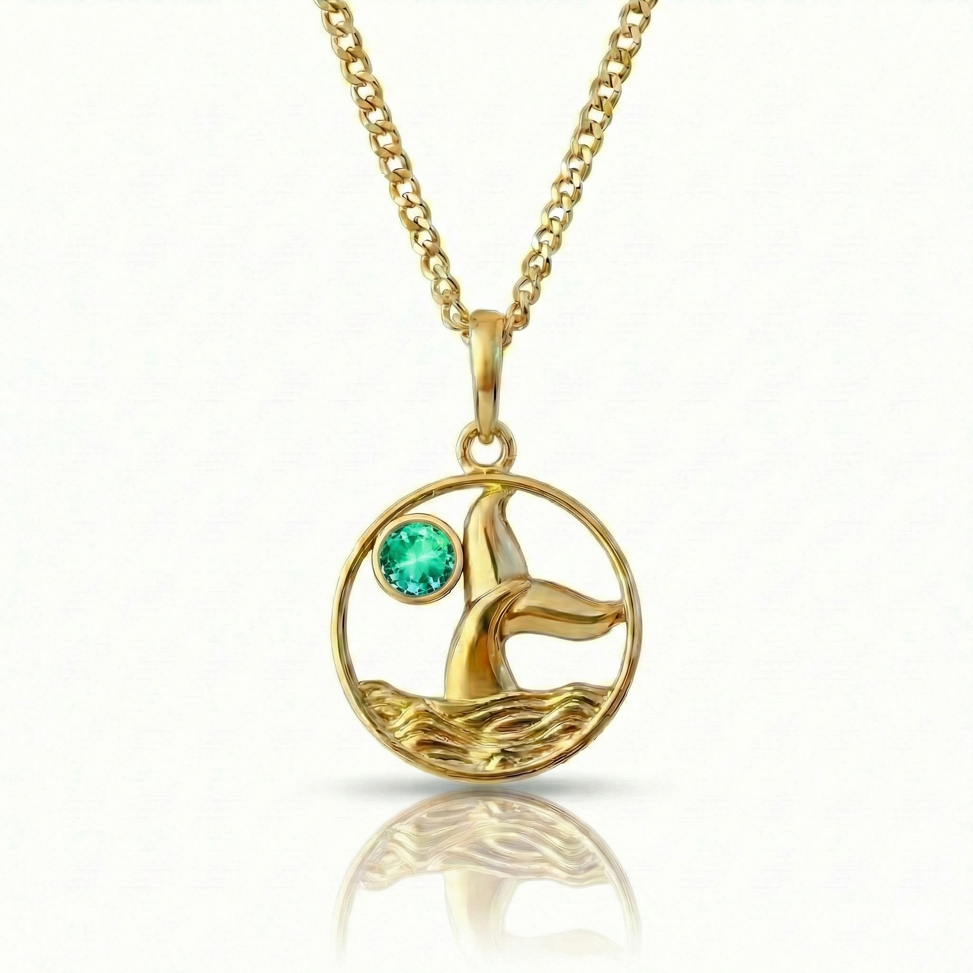 Whale tale pendant with 18K gold stainless steel and a green gemstone.