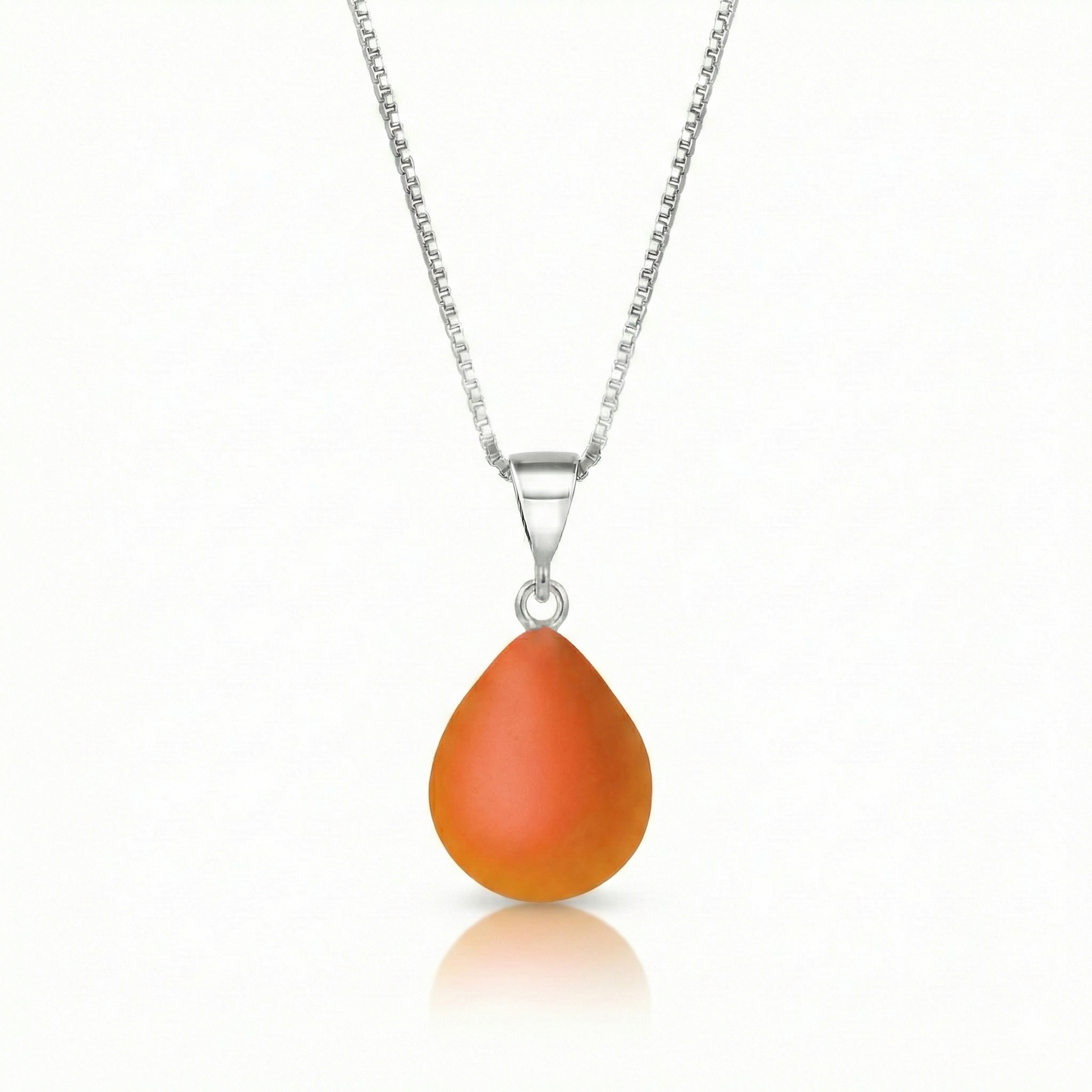 Our best selling crystal X-Small Drop Pendant is a beautiful, easy simple addition to any outfit. Handmade pendants come in a wide variety of colors and shine with an iridescent glow of color from within. Sterling silver .7mm box chain, 18" included with the frosted fire pendant.