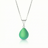 Our best selling crystal X-Small Drop Pendant is a beautiful, easy simple addition to any outfit. Handmade pendants come in a wide variety of colors and shine with an iridescent glow of color from within. Sterling silver .7mm box chain, 18" included with the frosted green pendant.