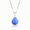 Our best selling crystal X-Small Drop Pendant is a beautiful, easy simple addition to any outfit. Handmade pendants come in a wide variety of colors and shine with an iridescent glow of color from within. Sterling silver .7mm box chain, 18" included with the polished blue pendant.
