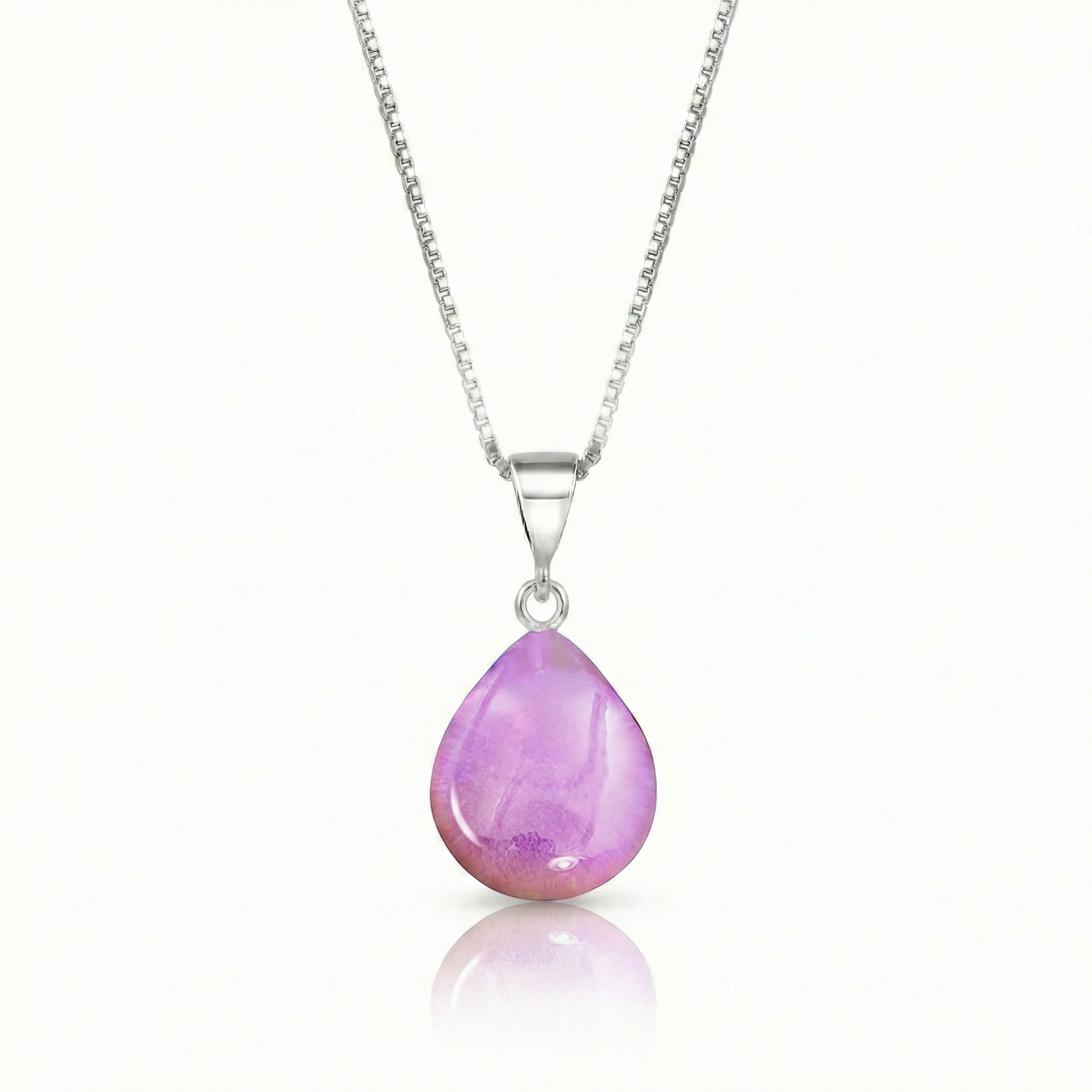 Our best selling crystal X-Small Drop Pendant is a beautiful, easy simple addition to any outfit. Handmade pendants come in a wide variety of colors and shine with an iridescent glow of color from within. Sterling silver .7mm box chain, 18" included with the polished pink pendant.