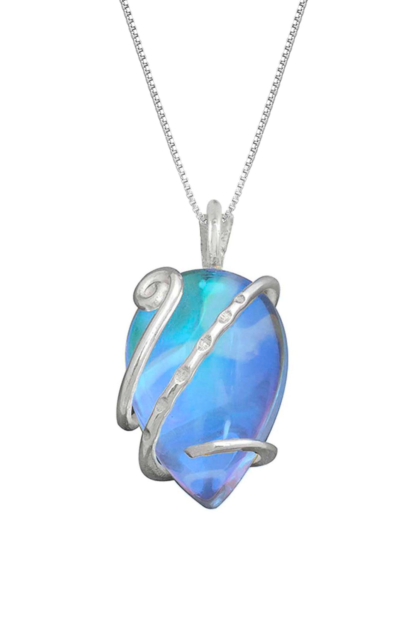 Single Wrap Pendant features a delicate sterling silver strand that beautifully wraps around a brilliant polished blue crystal. The pendant includes an 18" sterling silver .7mm box chain.